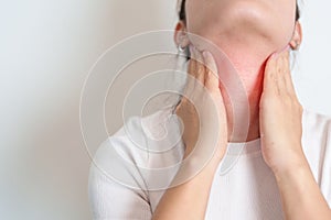 Woman checking Thyroid gland disease. Hand holding Neck pain. Hyperthyroidism, Hypothyroidism, Hashimoto Thyroiditis, Thyroid