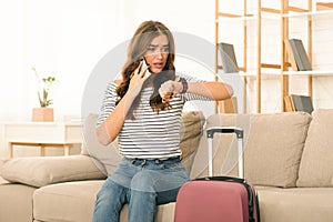 Woman Checking Time Anxiously as She Prepares to Leave Home