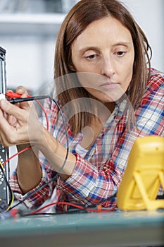 woman checking voltage pc