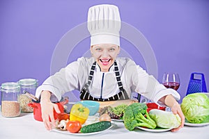 Woman chef cooking healthy food. Gourmet main dish recipes. Delicious recipe concept. Girl in hat and apron. Cooking