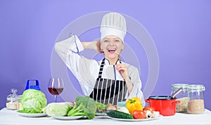 Woman chef cooking healthy food. Gourmet main dish recipes. Girl in hat and apron. Delicious recipe concept. Cooking
