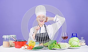 Woman chef cooking healthy food. Gourmet main dish recipes. Girl in hat and apron. Delicious recipe concept. Cooking