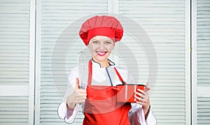 Woman chef hold whisk and pot. Girl in apron whipping eggs or cream. Start slowly whisking or beating cream