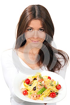 Woman chef holding the plate with italian pasta