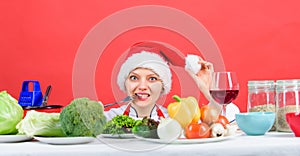 Woman chef or housewife cooking while wear santa hat. Best christmas recipes. Festive menu concept. Christmas dinner