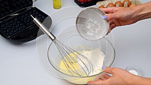 Woman chef mixing flour,eggs,cooking baking waffles,pancakes.breakfast food preparation,recipe instruction.healthy eating,bakery