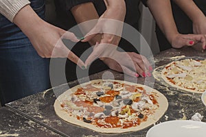 Woman chef with raw dough.