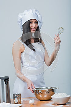 woman in chef uniform knead the dough