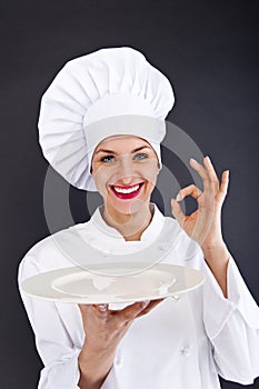 Woman cheff over dark backgrund