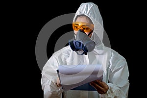 Woman in chemical protective clothing and antigas mask with glasses at white background, Women scientist in safety suit, Safety