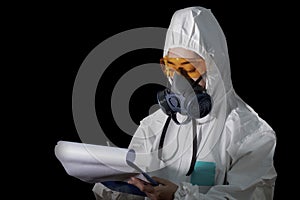 Woman in chemical protective clothing and antigas mask with glasses at white background, Women scientist in safety suit, Safety