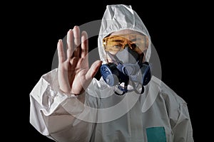 Woman in chemical protective clothing and antigas mask with glasses at white background, Women scientist in safety suit, Safety photo