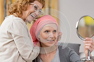 Woman after chemotherapy receiving scarf