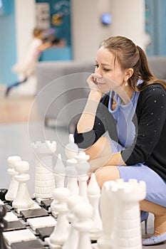 Woman at the chessboard