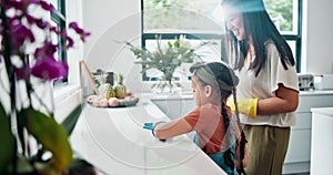 Woman, child and gloves to wipe, kitchen and counter for clean, health and safety in family home. Mother, girl and ppe