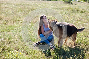 A woman with a child with German Shepherd training