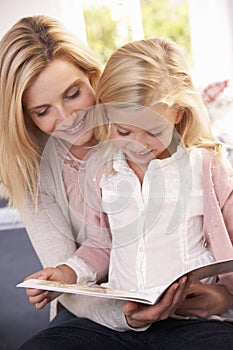 Woman and child reading together