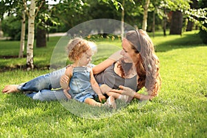 Woman with child in summer park