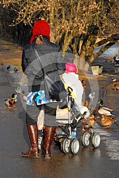 Woman and child walking in park