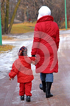 Woman with child walking in park