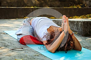 Woman in childe pose balasana outdoor autumn day photo