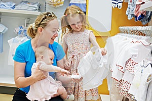 Woman with children in shop