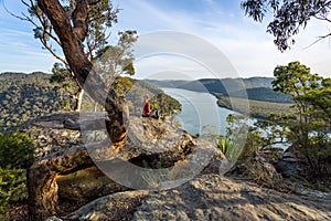 Woman chillaxing with river views in Australian bushland