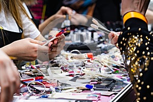 Woman chooses nail polish in a cosmetics store