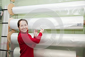 Woman chooses polythene for hothouse photo