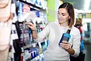 Woman choosing best mouthwash