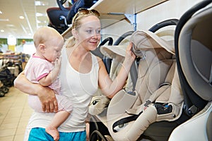 Woman choosing child car seat