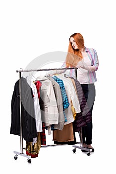 The woman choosing clothing in shop isolated on white