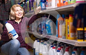 Woman choosing detergent