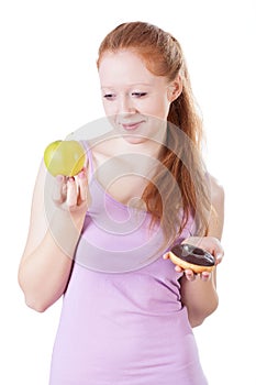 Woman choosing between fruits and sweets