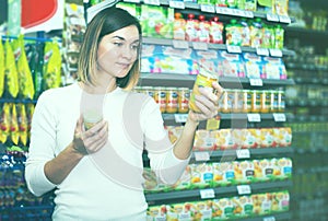 Woman choosing healthy baby food