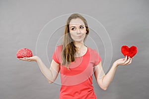 Woman choosing between love and mind