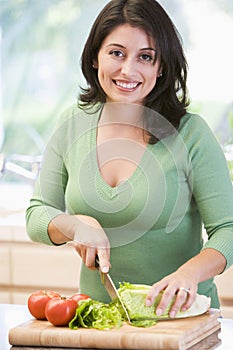 Woman Chopping Vegetables photo