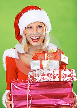 Woman, Christmas and gift in studio for smile celebration, happiness or festive season giving. Female person, face and