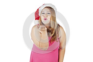 Woman in christmas hat blowing a kiss