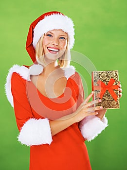 Woman, Christmas and holding present in studio for holiday giving, festive vacation or smile. Female person, red clothes