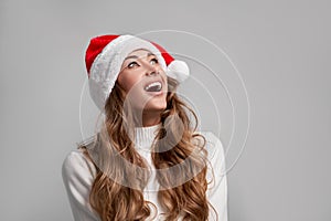 Woman christmas Santa Hat sweater white studio background