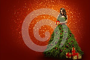 Woman in Christmas Tree Dress Holding Present Gift, Fashion Girl