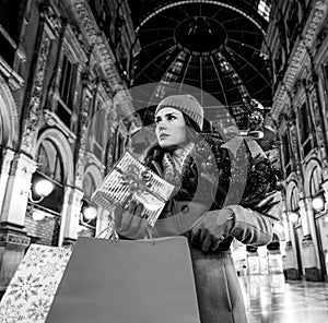 Woman with Christmas tree in Galleria Vittorio Emanuele