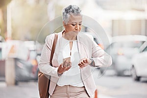 Woman in city, walking and checking time on wrist on morning commute to work or appointment. Street, schedule and