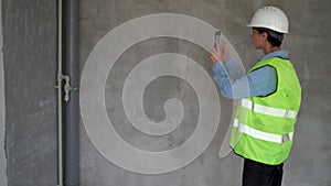 Woman civil engineer making photo work using smartphone at construction site. photo report manager