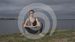 Woman in classical yoga pose, energy concentration