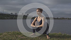 Woman in classical yoga pose, energy concentration