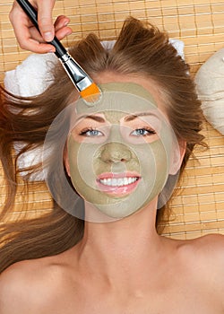 Woman with clay facial mask