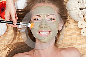 Woman with clay facial mask