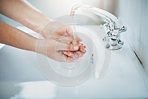 Woman, clean and washing hand with water at home for wellness, cleaning and hygiene in sink. Wash, hands and skincare to